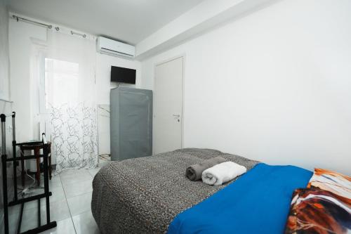 a bedroom with a bed with two towels on it at Casa Mia in Casorate Primo