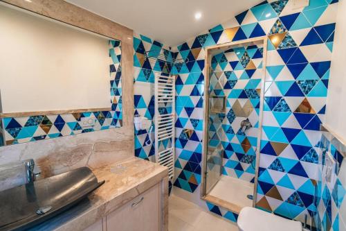a bathroom with a sink and a shower at Taormina Seaview - Luxury Apartment in Taormina in Taormina