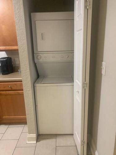 an empty white refrigerator in a kitchen at Welcome Home in Charlotte