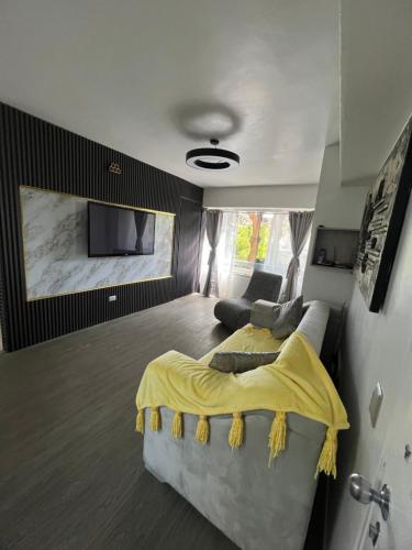 Ένα ή περισσότερα κρεβάτια σε δωμάτιο στο Río Dorado Apartamento Boutique