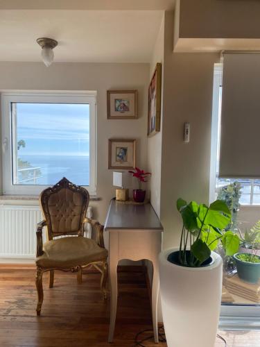 a room with a desk and a chair and a window at Villa Dinka VIP apartmani in Opatija