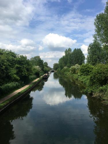 a river with boats on it in the middle at Beautiful Peaceful Studio Flat in Waltham Abbey