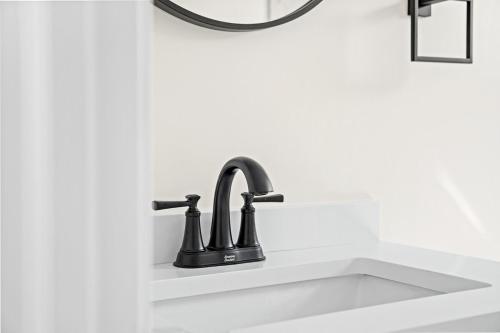 a bathroom sink with a black faucet at Recently Remodeled Mins from beach+Putting Green in Boynton Beach
