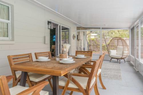 a dining room with a wooden table and chairs at Private Heated Pool 4 MI to Indian Rocks Beach in Largo