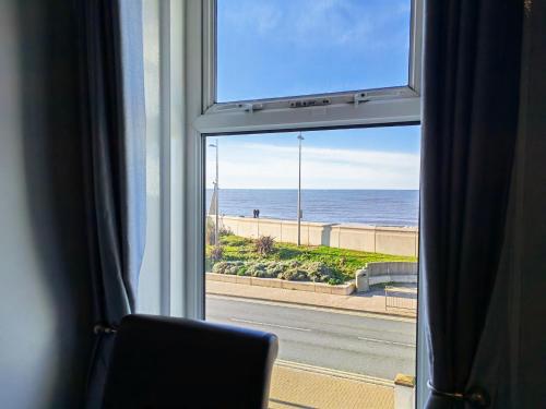 a view of the ocean from a window at Seahawk Holiday Apartments in Cleveleys