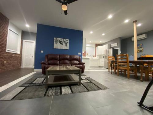 a living room with a couch and a table at Entire 2 Bed apartment in Allentown
