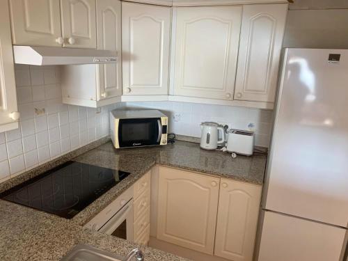 A kitchen or kitchenette at 2 Bedroom Townhouse In Puerto Colon