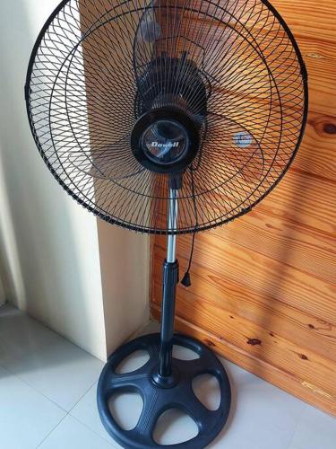 a fan sitting on top of a table at Evergreen Suites Cozy Baguio Loft Retreat in Baguio