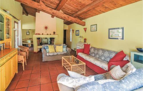 a living room with couches and a table at 6 Bedroom Stunning Home In Aups in Aups