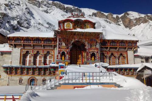 a large building with snow on top of it at RUPALI GUEST HOUSE in Badrinath