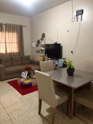 a living room with a table and a couch at Festival de Parintins 2024 in Parintins