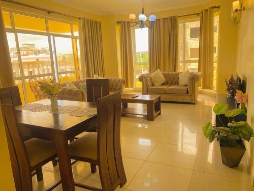 a living room with a table and a couch at 2bedroom apartment in nyali in Mombasa