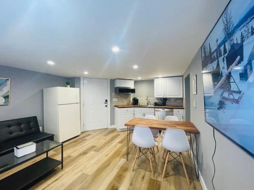 a kitchen and dining room with a table and chairs at Green Lake 1st Line Home D Full Modern Remodeled in Seattle