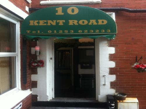 a sign for a kent road on a building at Deneside Guest House in Blackpool