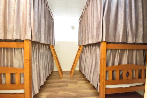 Ένα ή περισσότερα κρεβάτια σε δωμάτιο στο Dongjin B&B