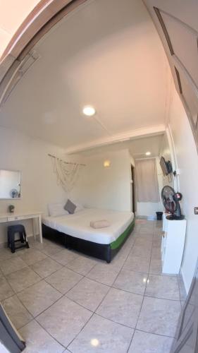 a bedroom with a bed in a room at Sinurambi 2 in Kundasang