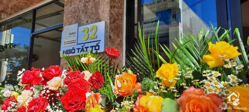 a display of colorful flowers in front of a store at Friendly Homestay in Kon Tum