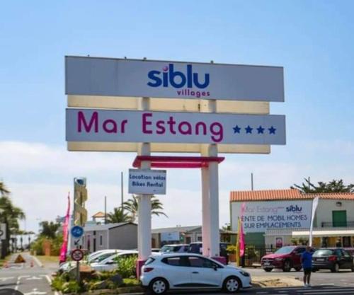 a sign for a mar gas station in a parking lot at MOBILHOME SOLEIA NEUF 2023 MAR ESTANG SIBLU VILLAGE Canet-en-Roussillon in Canet-en-Roussillon