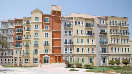 a large apartment building with many windows at Discovery Gardens Haven Studio Units in Dubai