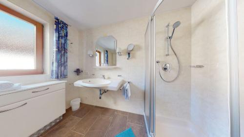 a bathroom with a shower and a sink at Apart Alte Straße in Nauders