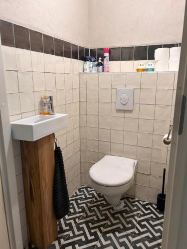 a bathroom with a toilet and a sink at Private 3 bedroom apartment - HomeStay Properties Amsterdam in Amsterdam