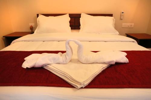 Cama o camas de una habitación en Swastida Ayur Resorts