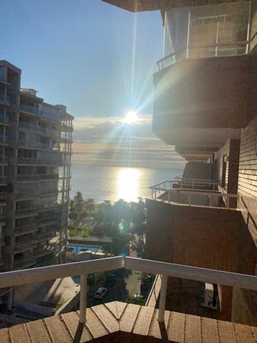 a view of the sun from a balcony of a building at Apartamento Costa Marina 3 in El Borseral