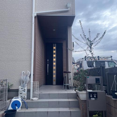a front door of a house with a stairway at MiShe主题南行徳民宿 in Tokyo