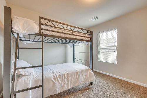 a bedroom with two bunk beds and a window at Spacious Atlanta Home with Yard and Charcoal Grill! in Atlanta