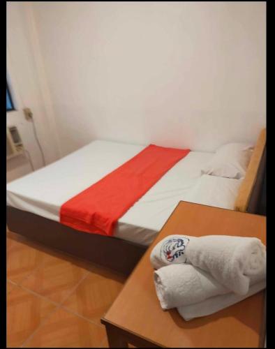 En eller flere senge i et værelse på Auzone Inn Budget Hometel