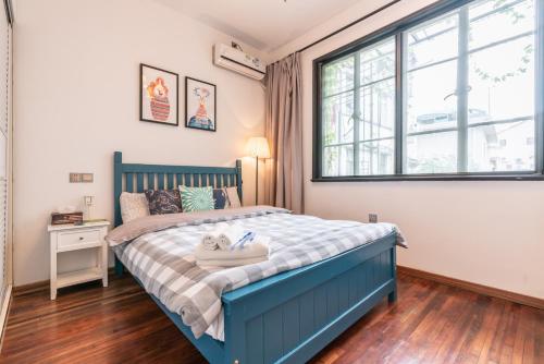 מיטה או מיטות בחדר ב-Shanghai Hills&XING584 Homestay