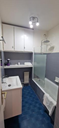a bathroom with a shower and a sink and a tub at Roque in Roquebrune-Cap-Martin