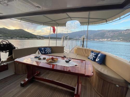 a table on the back of a boat on the water at Albatros-Q in Kas