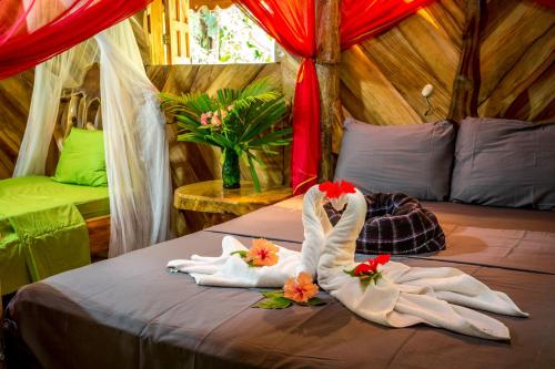 Un pat sau paturi într-o cameră la Hotel La Costa de Papito