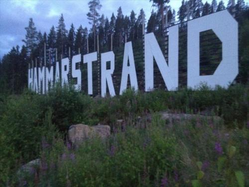a large sign that sayshumanifting on top of a mountain at Villa Stuga in Hammarstrand