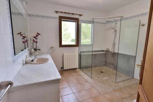 a bathroom with a shower and a sink at Sa Tanca Gran in Sineu