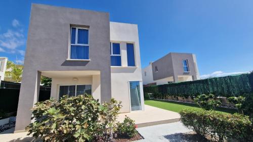 a house in the middle of a yard at Villa Paraiso-Luxury Villa with Heated Pool in Adeje