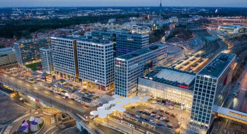 an aerial view of a city with tall buildings at Modern LUXUS 3BR apartment Helsinki Tripla in Helsinki