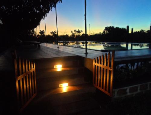 a set of stairs with lights at dusk at Eco Hotel Black & White - Anuradhapura in Mihintale