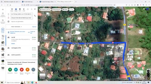 a map of a road with a blue line at F1 studio Martinique in Quartier la Fleury Guiné