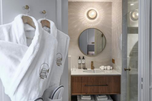a bathroom with a sink and a mirror at Grand Hôtel Du Parc - Teritoria in Aix-les-Bains