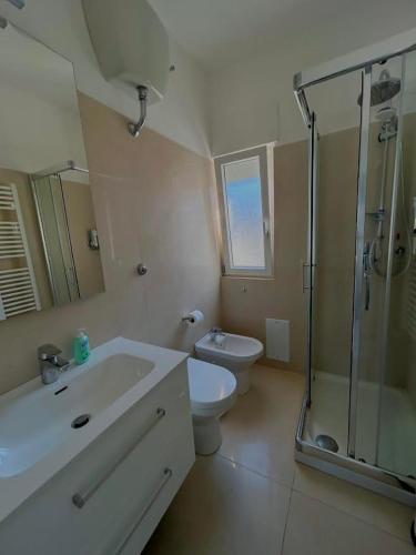a bathroom with a sink and a toilet and a shower at Capri Melody in Anacapri