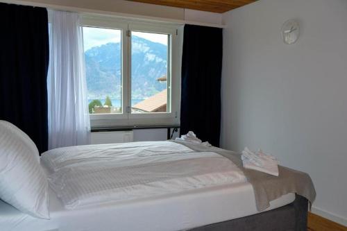 Postel nebo postele na pokoji v ubytování Mariposa Spiez