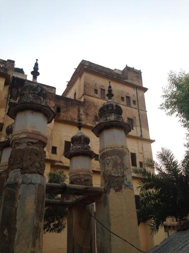 an old building with columns in front of it at Narayan Niwas Castle in Rāmgarh