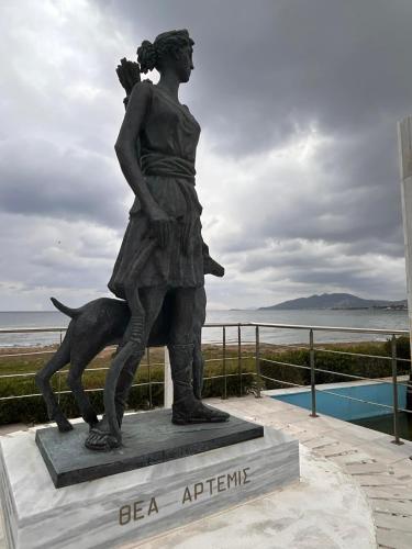 a statue of a woman and a dog at Artemis Beach Holiday Nest 1 in Artemida