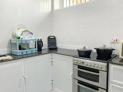 A kitchen or kitchenette at BUDGET HOMES ZANZIBAR