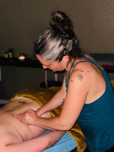 a woman sitting on a bed with a man with tattoos at Cabanots - Ecolodges en Vallée d'Ossau à 900m d'altitude in Castet