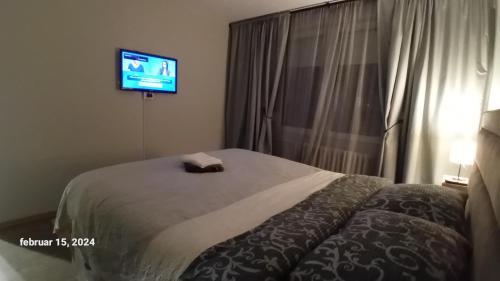 Una cama o camas en una habitación de SUNSHINE Apartment