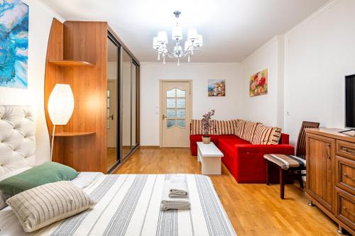 Zona d'estar a Just another comfy apartment on the main squere. 2 bedrooms, own heating, AC
