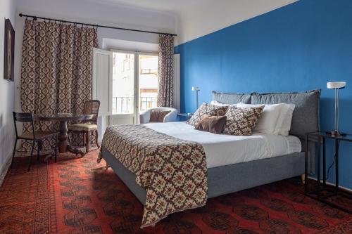 En eller flere senge i et værelse på Angelica House